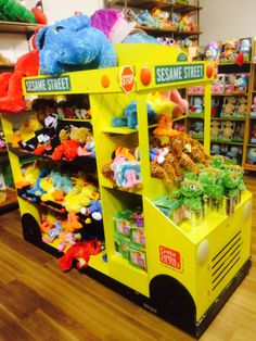 there is a toy store with stuffed animals on the shelves