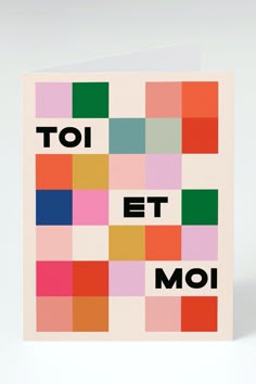 a greeting card with the words toi et moi in multi - colored squares on it