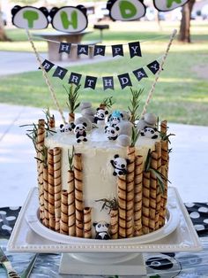 Panda Theme Cake, Bamboo Cake Ideas, Bamboo Cake, Panda Cake, Panda-themed Cake With Wafer Decorations, Panda Cake With Bamboo, Panda Cake With Bamboo Decorations, Panda Eating Bamboo Cake, Panda-themed Cake With Bamboo Sticks