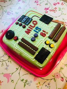 a cake that is shaped to look like a computer game console with the words who's on it