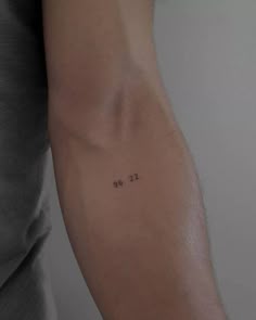 a person with a small tattoo on their arm