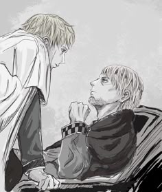 two young men sitting next to each other