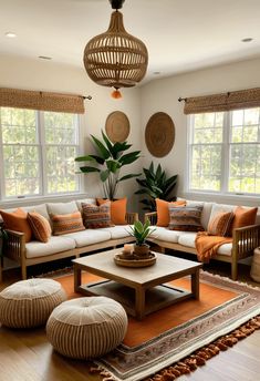 a living room filled with lots of furniture and decor on top of a wooden floor