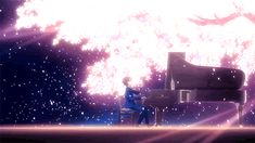a man sitting at a piano in front of a large explosion of fireworks and stars