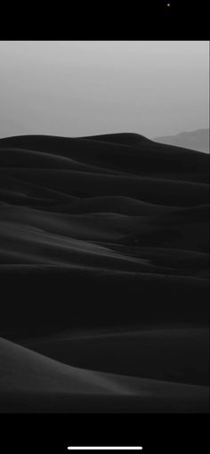 black and white photograph of sand dunes in the desert