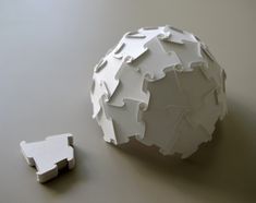 two pieces of paper that are on the floor next to each other, with one piece missing