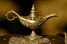 a golden teapot sitting on top of a table