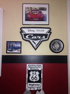 the wall has cars on it and pictures above them with other things to do in this room