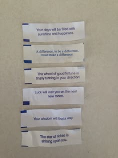 three pieces of paper taped to the wall with words written on them and some type of adhesivement