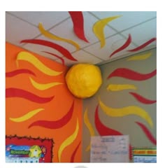 the sun is painted on the wall in an office