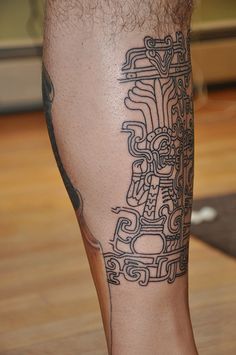 a man with a tattoo on his leg