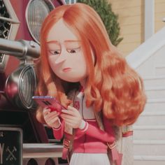 a doll is looking at her cell phone