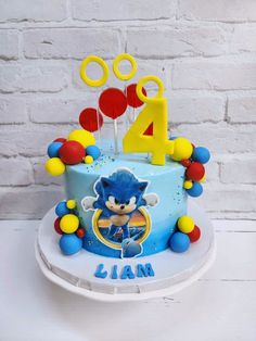 a birthday cake with the number four on it and sonic the hedgehog theme is shown