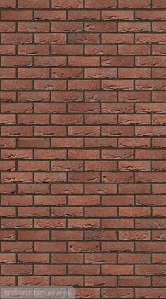 a red brick wall that is very close to the ground with no bricks on it