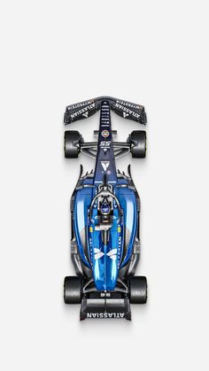 a blue race car is shown from the top down on a white background with no people around it