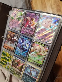a bunch of pokemon cards are in a suitcase