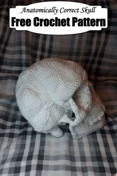 a stuffed animal that is sitting on a plaid blanket with the caption free crochet pattern