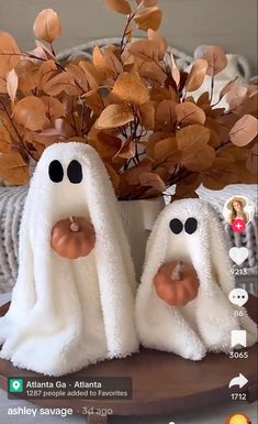 two fake ghost towels sitting on top of a table