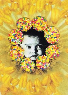 a child's face is surrounded by sprinkles and yellow flowers in the background