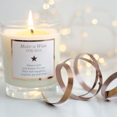 a candle that is next to some ribbon