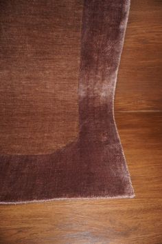 an area rug is laying on the floor