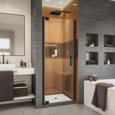 a bathroom with a walk in shower next to a bathtub and sink under a mirror