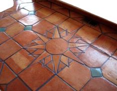 a bathroom floor that has been painted with different colors