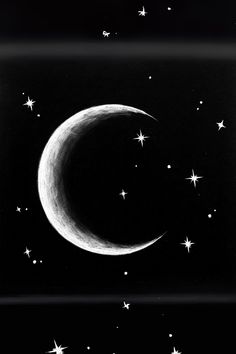 a black and white photo of the moon with stars in the night sky above it