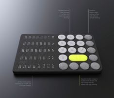 a close up of a remote control on a black surface with information about the buttons