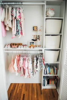 the closet is full of baby clothes and other things to put in it's storage area
