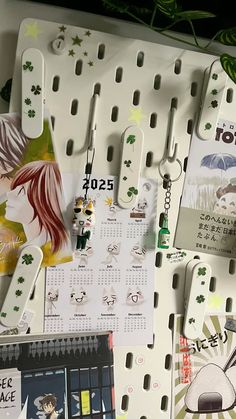 the wall is covered with magnets and calendars for people to write on them