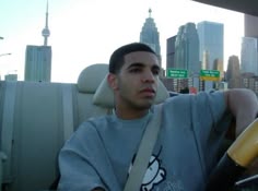 a man sitting in the back seat of a car