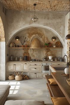 a kitchen with stone walls and an arched ceiling