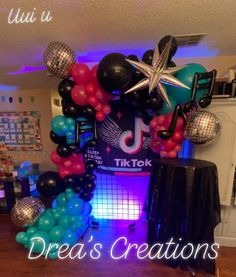 balloons and streamers decorate the entrance to a dance themed birthday party at tiktok