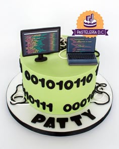 there is a cake that has two laptops on it and the words party written in black