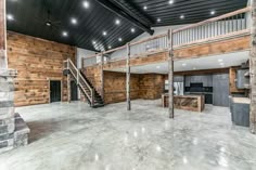 an open floor plan with stairs leading up to the second story