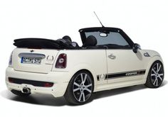 a white convertible car with the top down