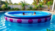 two people playing in an inflatable pool