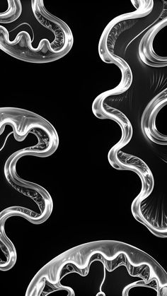 some very pretty glass pieces in black and white colors with an interesting pattern on them