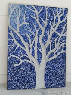 a blue and white tree is featured on the pinterest page in this post