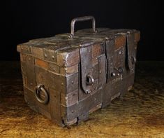 an old wooden box sitting on top of a table
