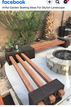 an outdoor seating area with benches and fire pit