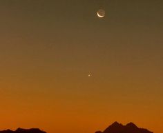 the moon and venus are seen over mountains