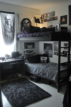 a bedroom with two bunk beds and pictures on the wall above it, along with a desk