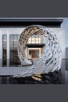 an artistic sculpture in front of a building