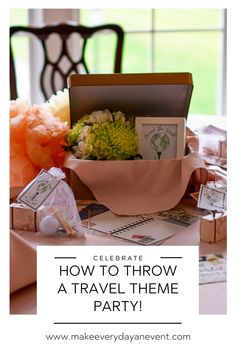 a table topped with boxes and flowers next to a sign that says how to throw a travel theme party