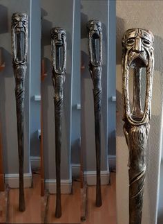 four different types of carved metal objects in a row on the floor next to each other