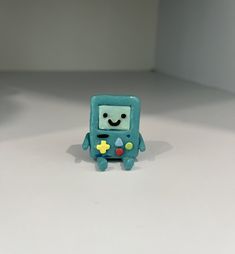 a small toy with a smile on it's face