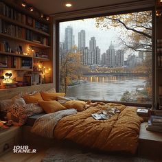 a bedroom with a large window overlooking the river and cityscape in the background