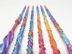 there are many different colored toothbrushes lined up together